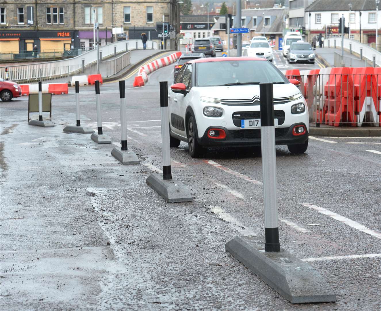 New poles are replacing plastic distancing barriers on Bridge Street. Picture: Gary Anthony