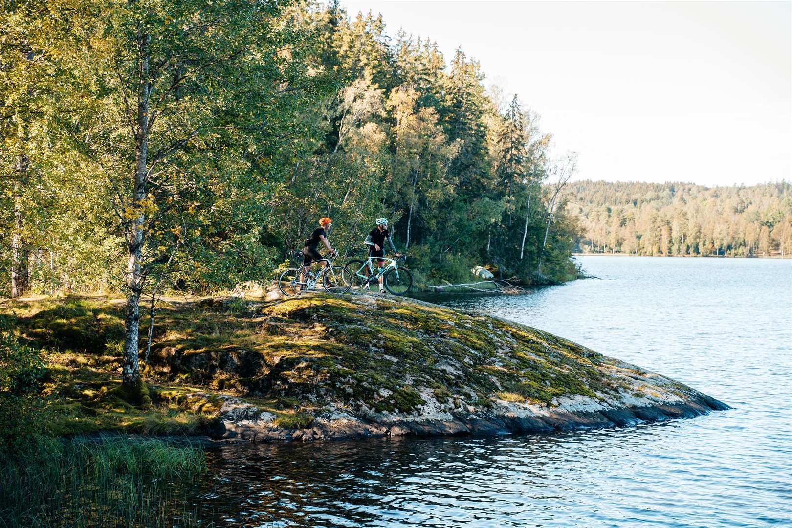 Ben Mitchell and guide cycling champion Eric Sjogren taking in the lake view in Smaland, Sweden. Picture: PA Photo/Alexander C Svensson/Smaland Tourism