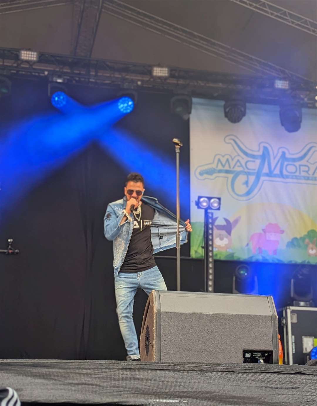 Peter Andre performing live on stage.