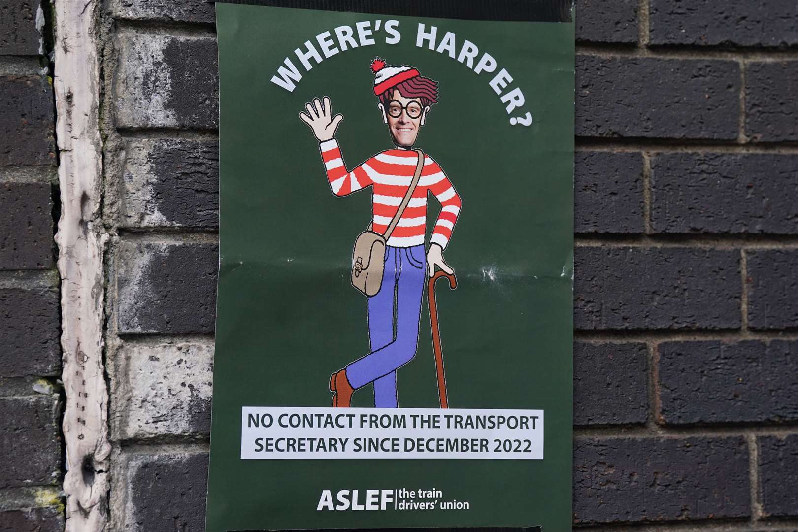 Aslef poster displayed at a picket line at Euston station in London (Lucy North/PA)