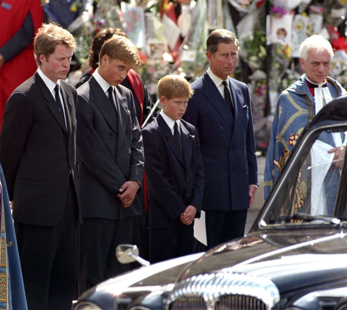 Earl Spencer, William, Harry and the then-Prince of Wales, wait as the hearse carrying the coffin of Diana, Princess of Wales, prepares to leave Westminster Abbey in 1997 (Fiona Hanson/PA)