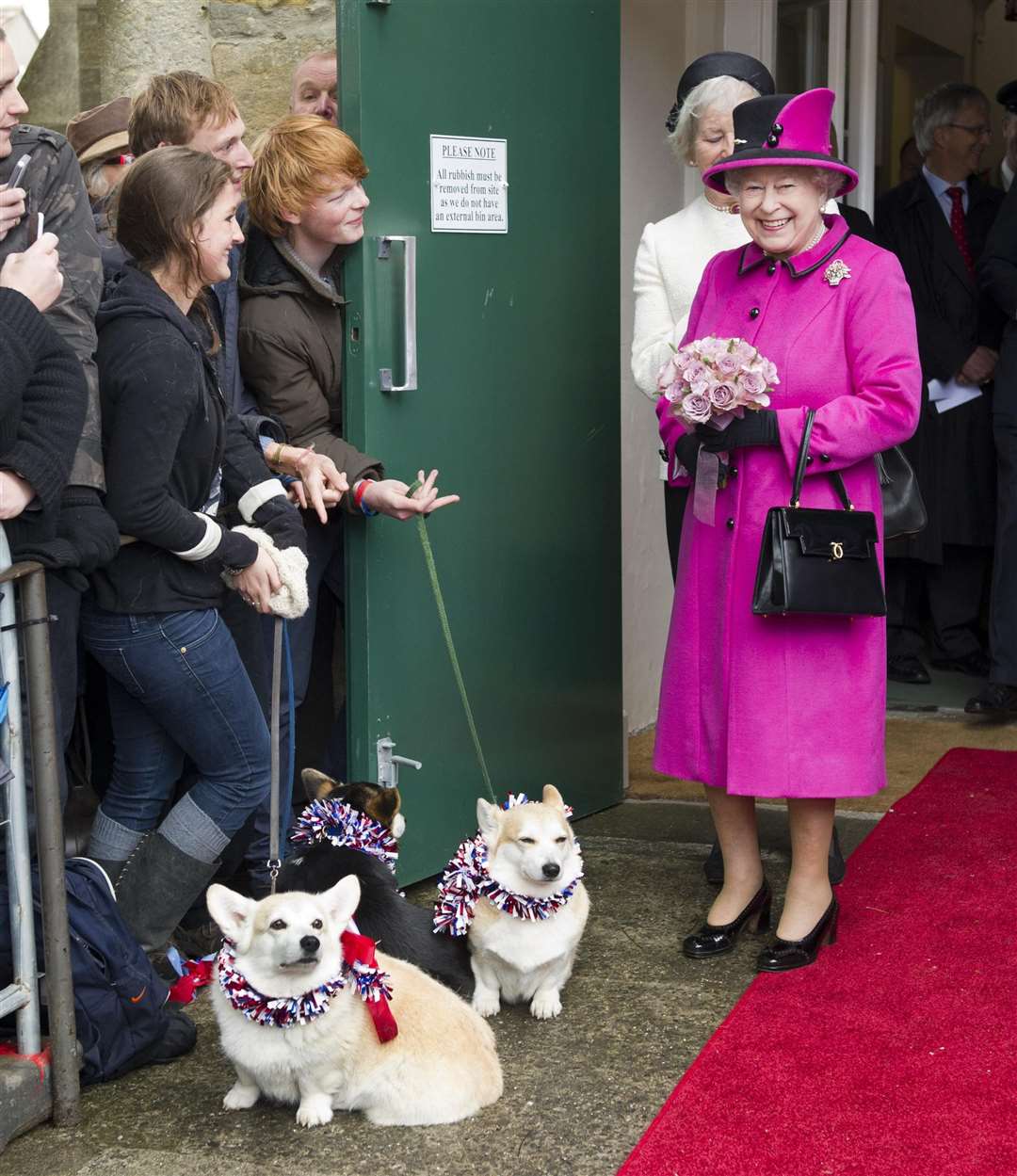The Queen is greeted by corgis at Sherborne Abbey during her Diamond Jubilee tour of the UK in 2012 (Arthur Edwards/The Sun/PA)
