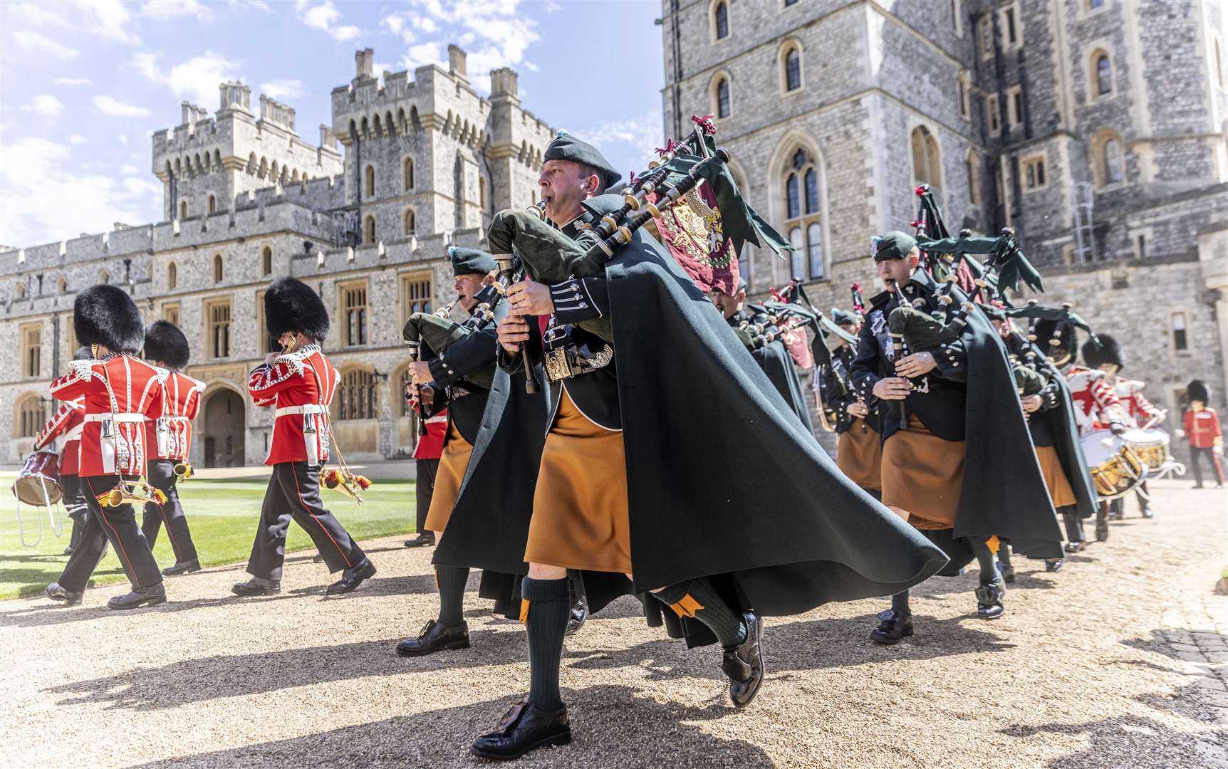 Pipers of the 1st Battalion Irish Guards march into the Quadrangle of Windsor Castle where new regimental colours were presented by the Duke of Cambridge (Richard Pohle/The Times/PA)