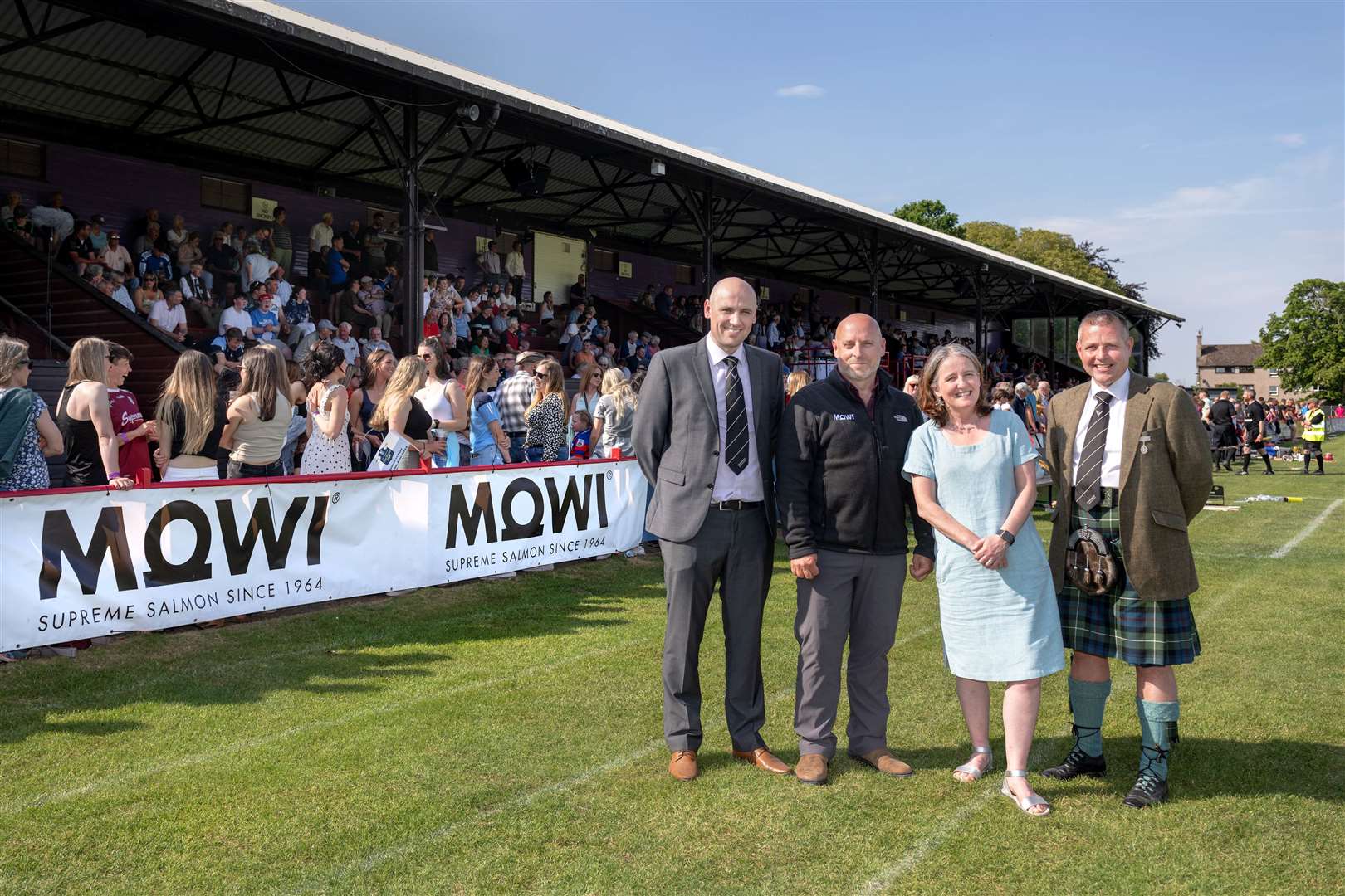 Derek Keir (Camanachd Association CEO); Ian Roberts (Mowi Director of Communications); Maree Todd (Minister for Social Care, Mental Wellbeing and Sport) and Steven MacKenzie (Camanachd Association President) at the 2023 cottages.com MacTavish Cup Final. Picture: Neil Paterson