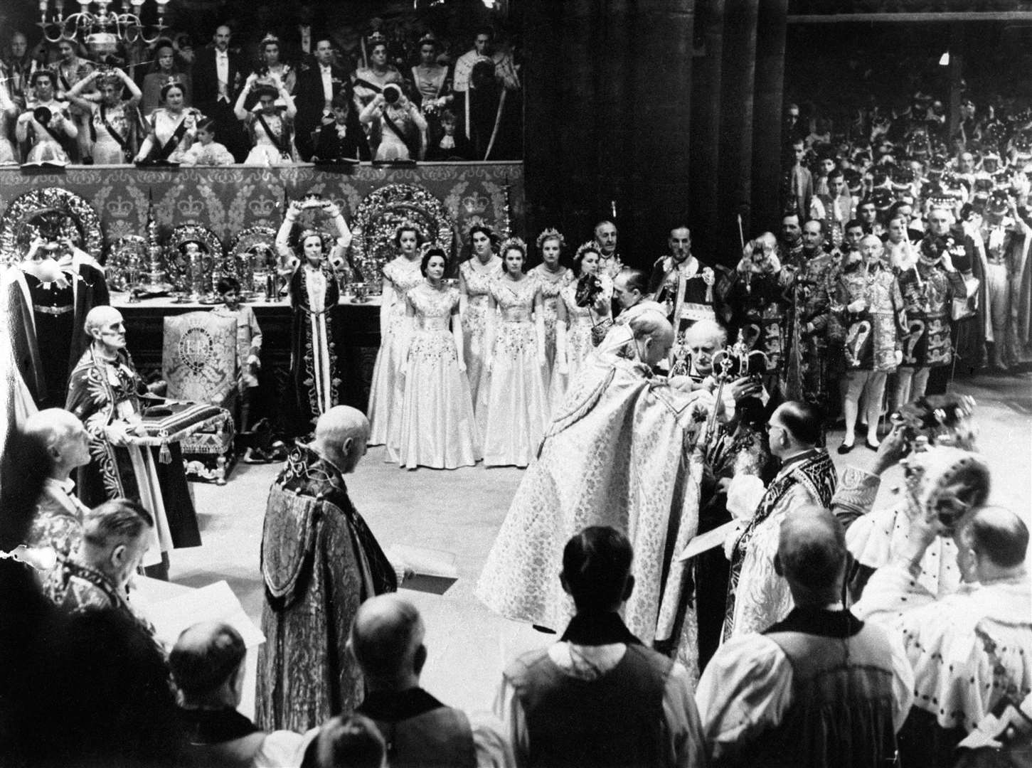 Prince Charles (top left) in the royal box at Westminster Abbey as the Archbishop of Canterbury places St Edward’s Crown on the Queen (PA)