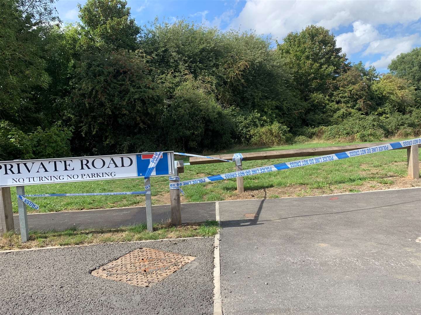 A nearby area of land cordoned off with police tape (Josh Payne/PA)