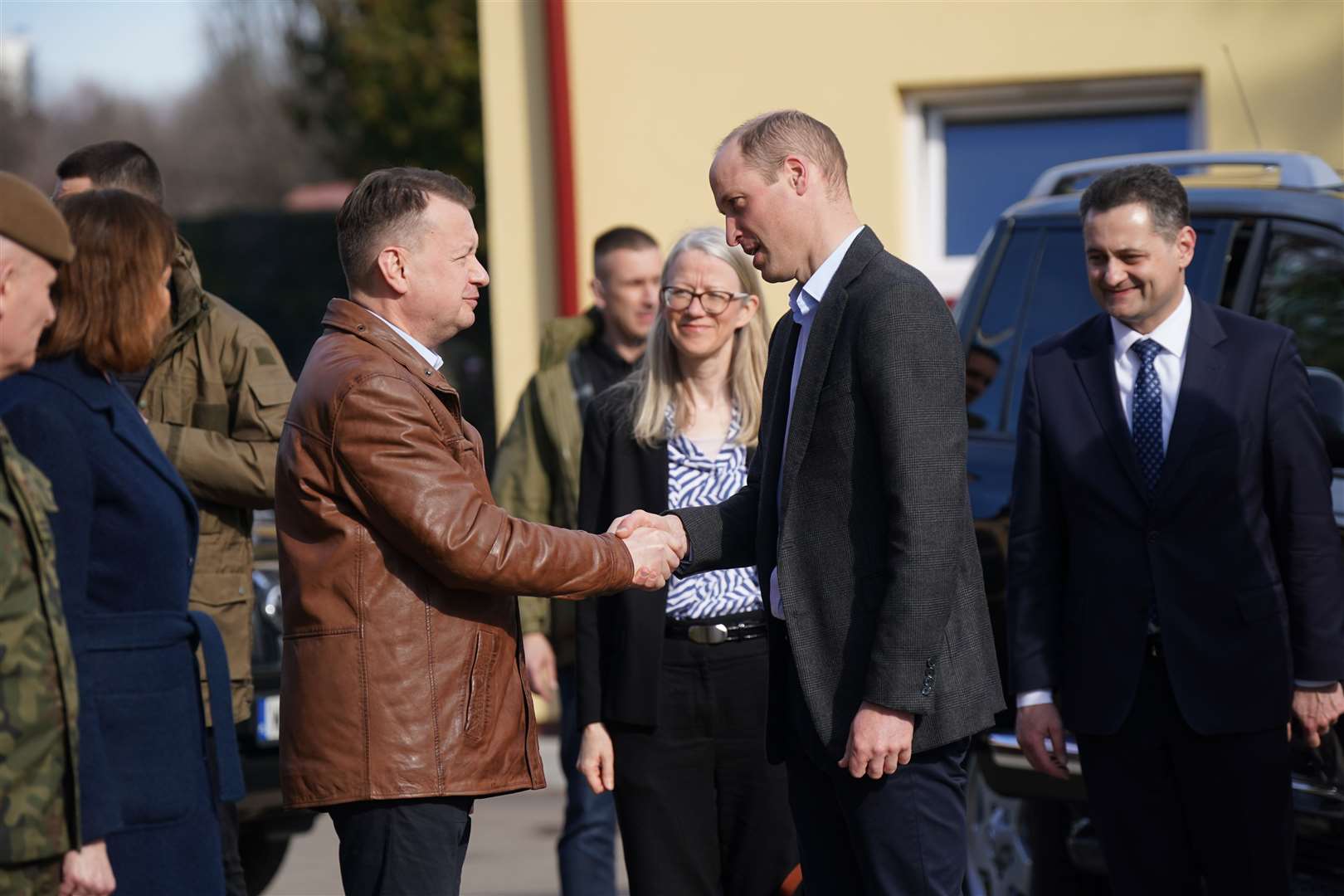 The Prince of Wales is greeted by Polish deputy prime minister and minister of national defence Mariusz Blaszczak as he arrives for a visit to the 3rd Brigade Territorial Defence Force base in Rzeszow, Poland (Yui Mok/PA)