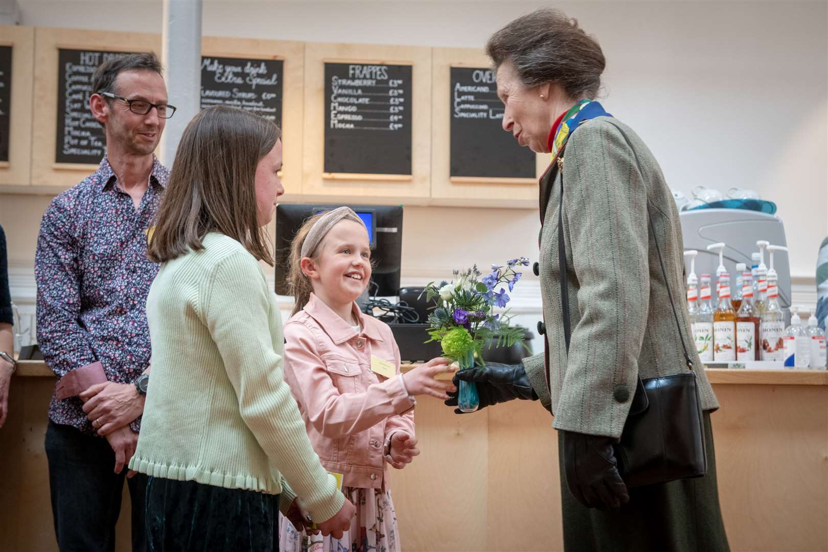 Amelia and Charlotte Irish present The Princess Royal with a vase of flower. Picture: Callum Mackay