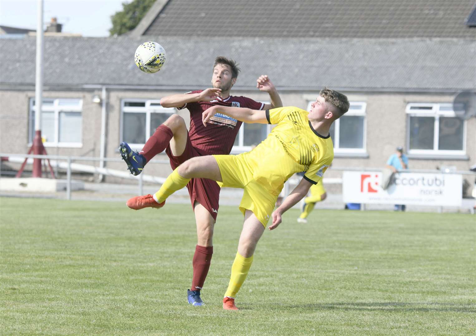 Keith's James Brownie and Clach's James Anderson going head to head. ..Keith FC v Clachnacuddin FC...Picture: Beth Taylor.