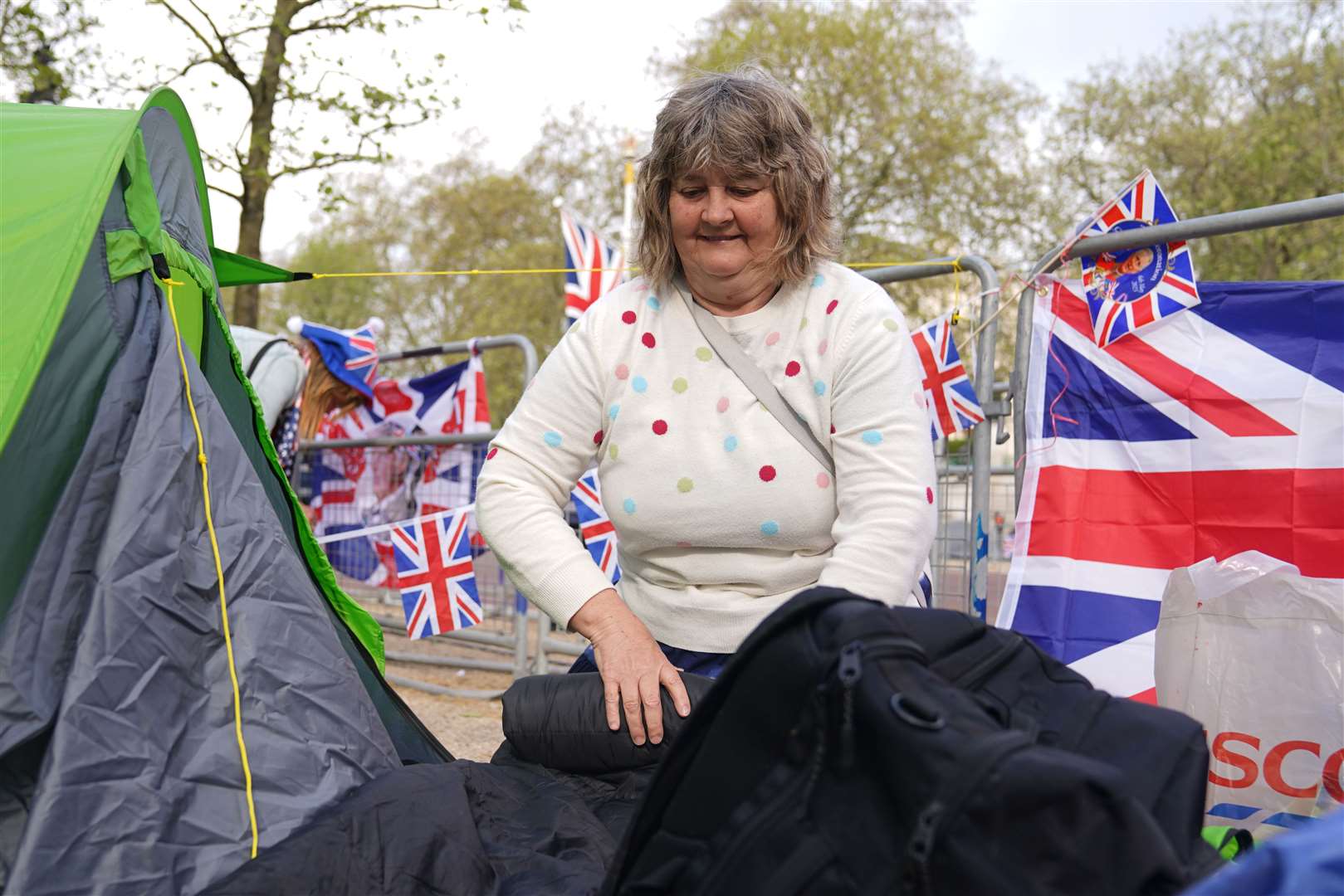 Kim Bilson, from Poole in Dorset, who is already in position along The Mall in central London ahead of the coronation (James Manning/PA)