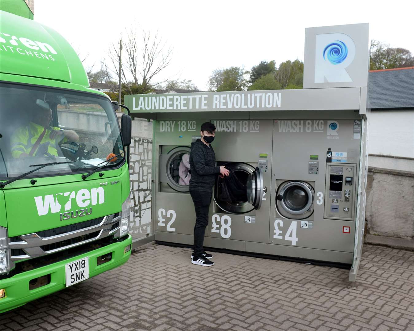 Blackpark Filling Station launderette machine..Liam Mapplebeck gets his laundery..Picture: Gary Anthony..
