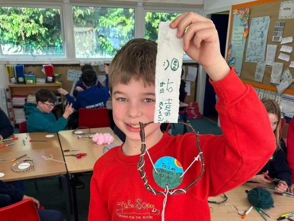 Ollie (P6), from Tore Primary, showing his biodegradable crafts.