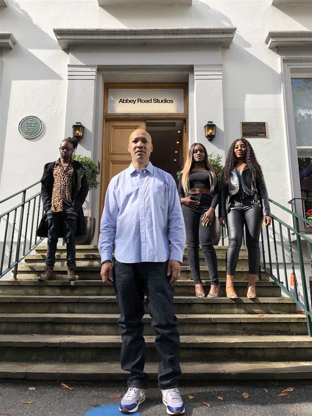 Matthew Phillip, executive director of Notting Hill Carnival, with Don-E (back left) and Sundivas (back right) (Catherine Wylie/PA)