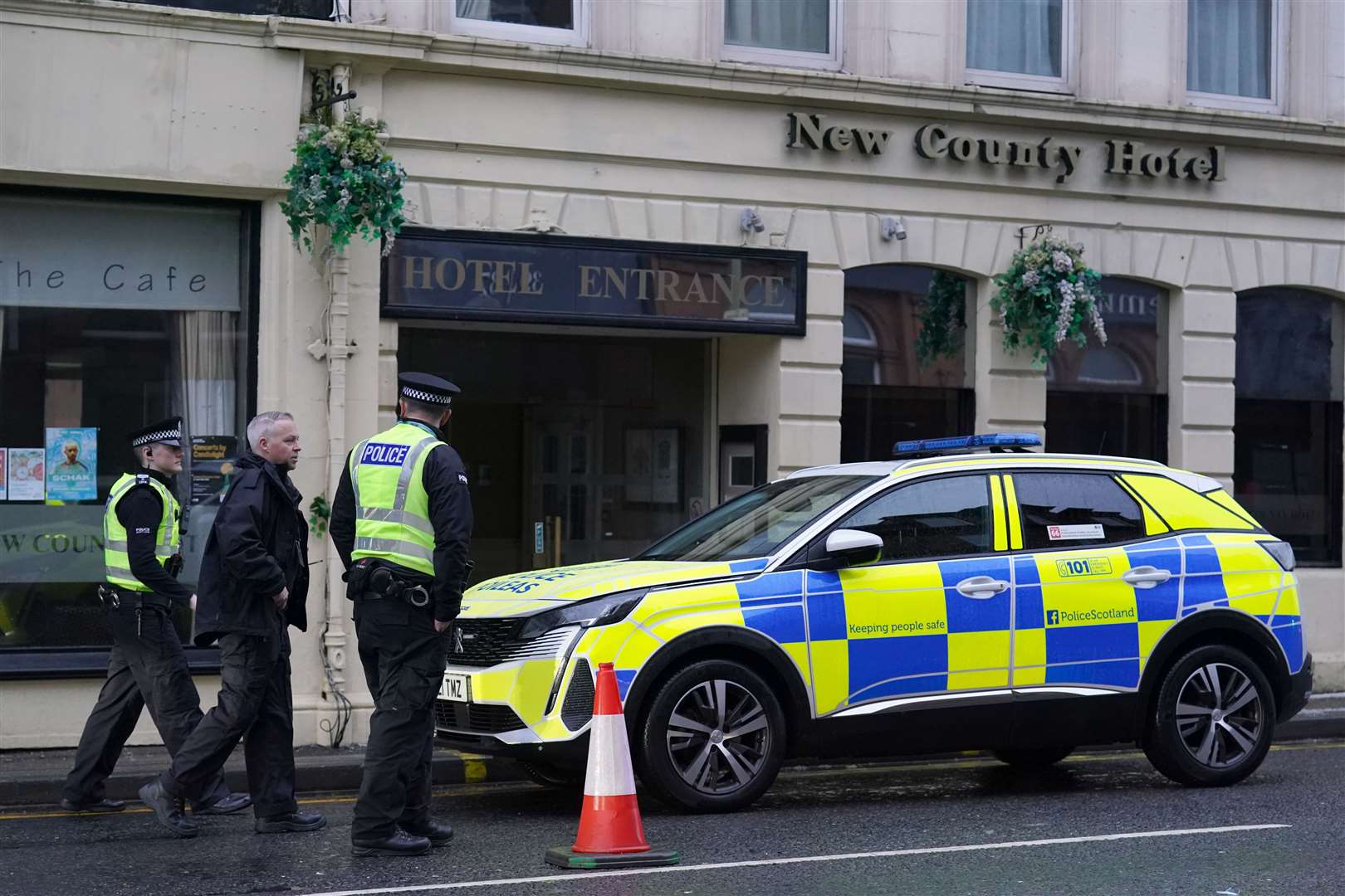 Police remain at the scene (Andrew Milligan/PA)