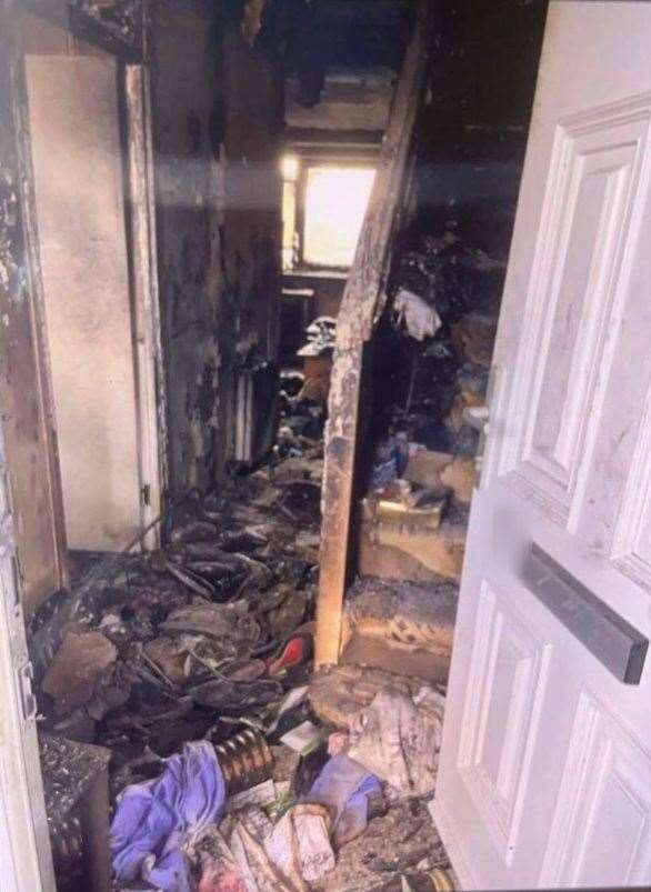 Fire damage evident inside the property.