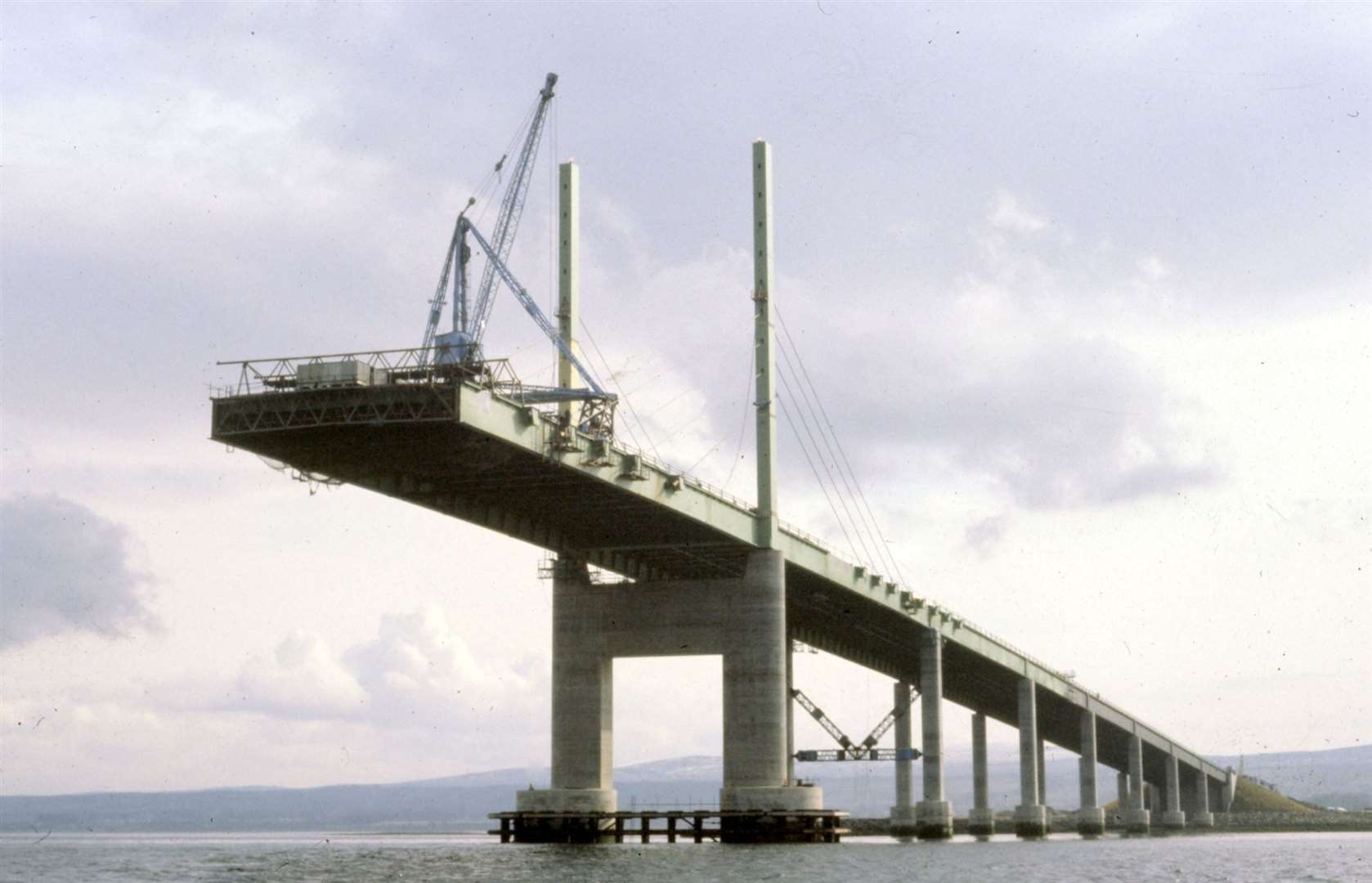 A dramatic image showing the south side of the bridge reaching out towards the Black Isle.