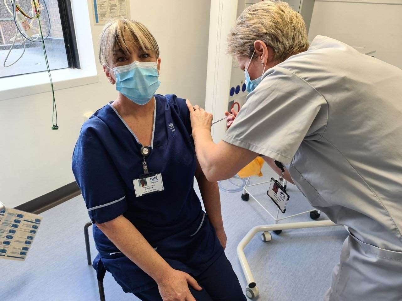 Senior charge nurse Gwen Calder, critical care, receives the vaccination.