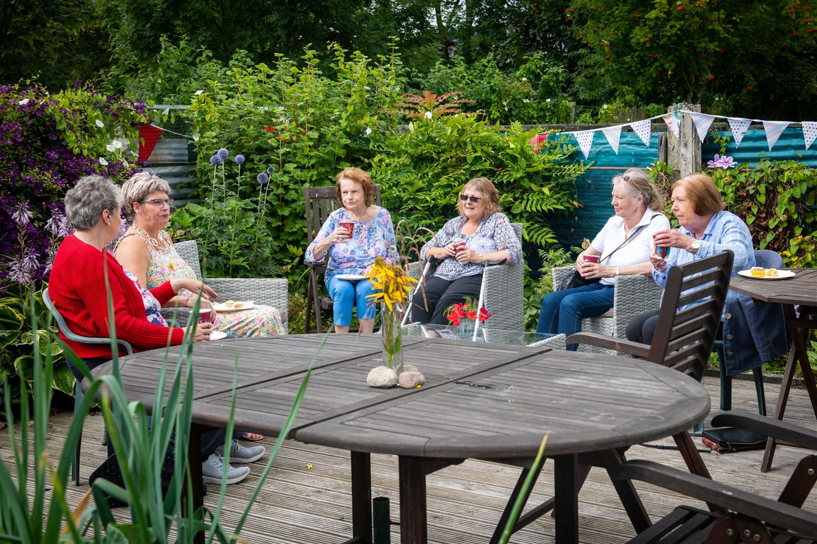 Visitors enjoy a chat and a cuppa at the Beauly Cares Community Garden open day. Pictures: Callum Mackay..