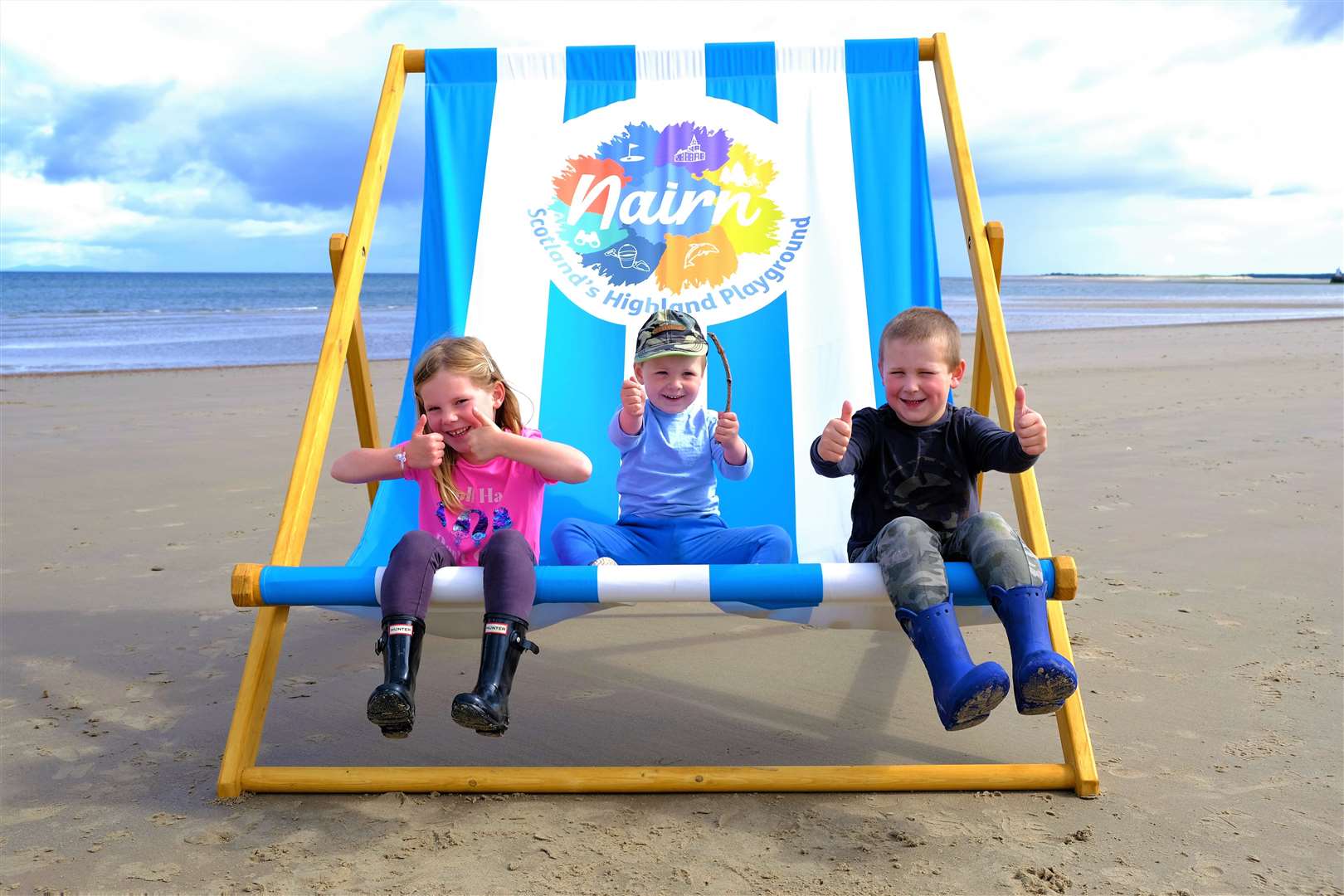 Youngsters on the beach give the thumbs up to Nairn's new moniker.