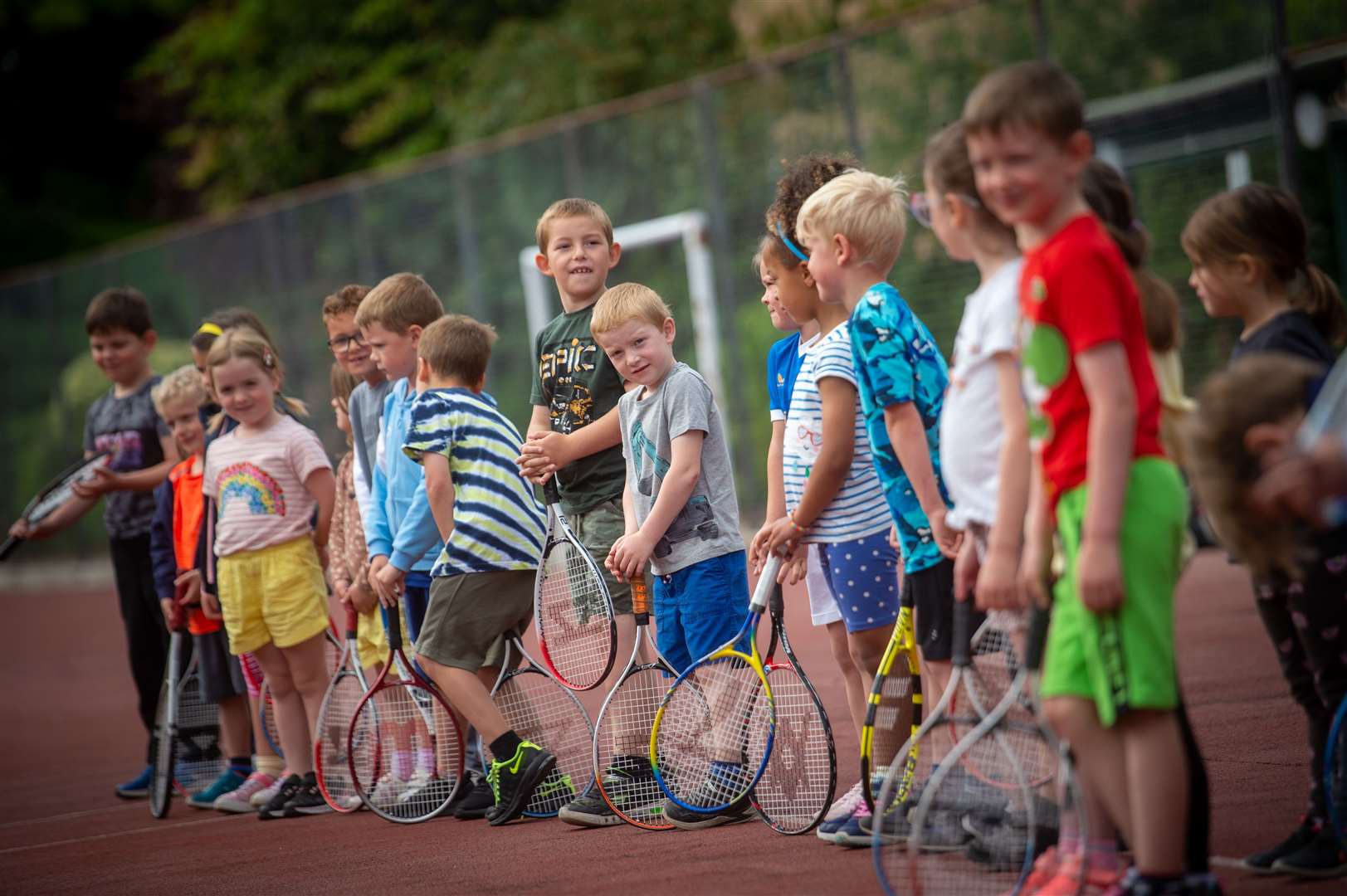 Kids learning how to play tennis. Picture: Callum Mackay