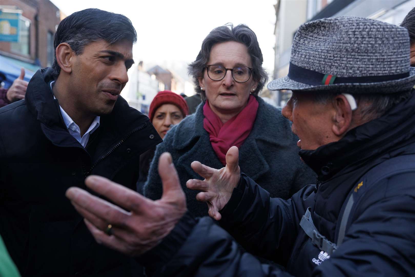A man talks to Rishi Sunak as he meets members of the public during a walkabout in Winchester, Hampshire (Dan Kitwood/PA)