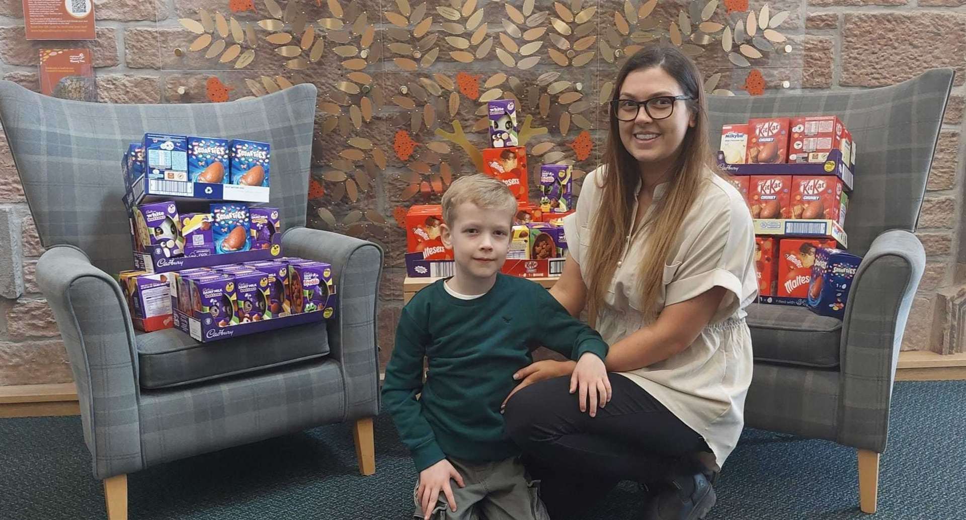 Chloe Wooley and little Theo with some of their Easter eggs donation to Highland hospice