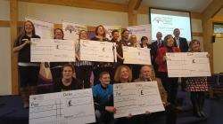 The successful groups with their cheques.