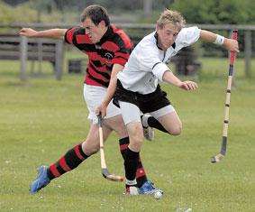 Andrew Corrigan of Glenurquhart and Lorne MacKay of Lovat tangle during their Cup clash.