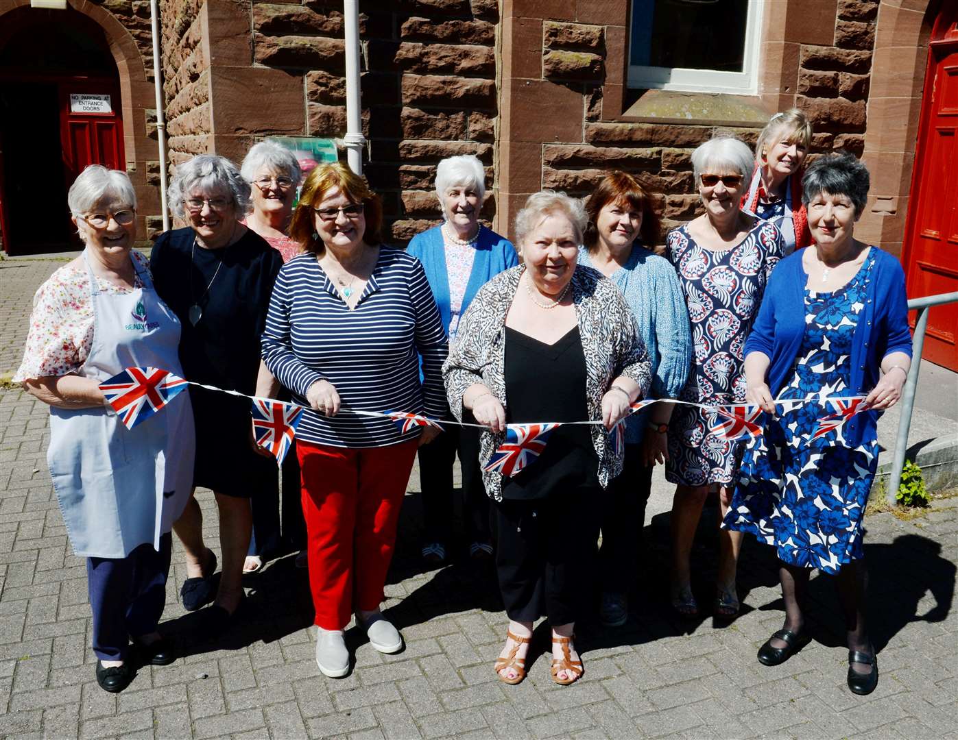 Volunteers get out the bunting for the jubilee tea at the Phipps Hall in Beauly.