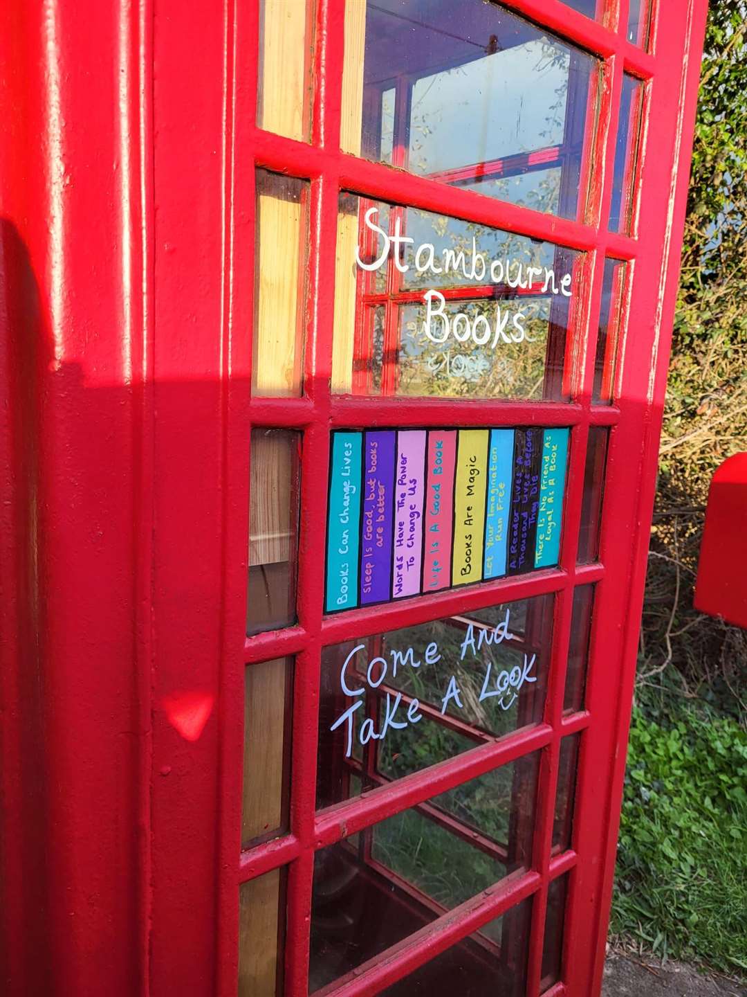 The telephone box library has sayings etched on the windows (Iona Connolly/PA)