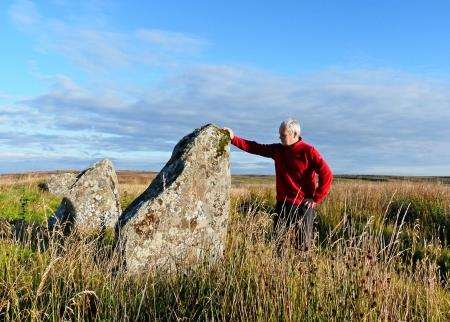 Alan beside one of the standing stones at Achavanich.