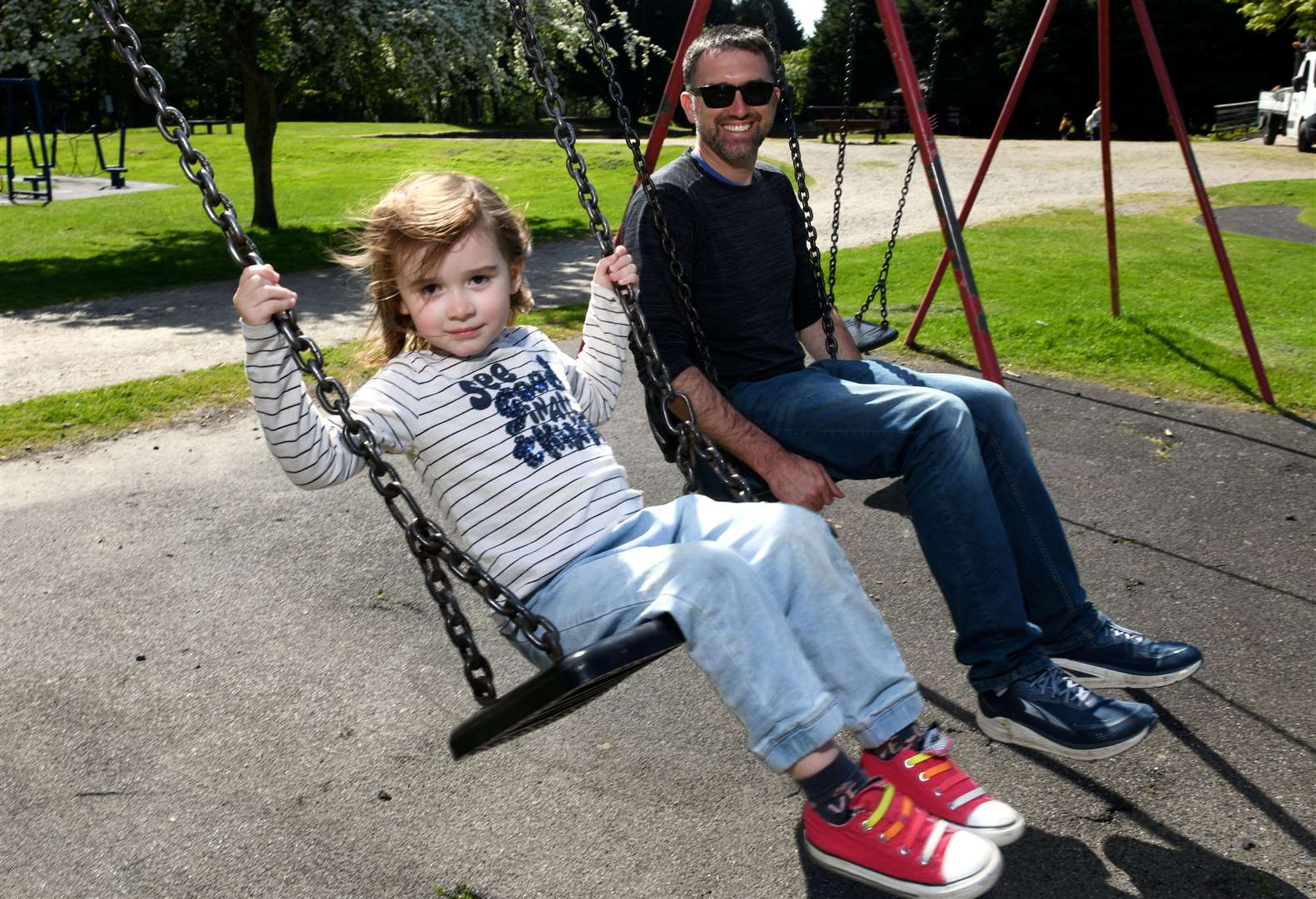 Maeve and Pat McAfee on the swings at Whin Park. Picture: James Mackenzie