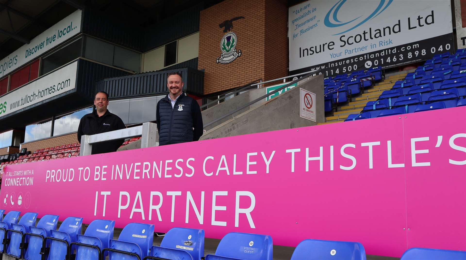 Andy Mckay, General Manager, Converged and Keith Haggart, Commercial Manager, ICTFC celebrate IT partnership at Caledonian Stadium.