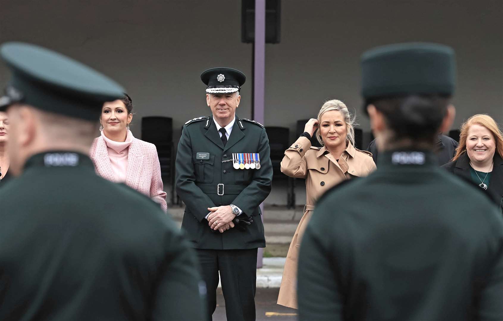 DUP deputy First Minister Emma Little-Pengelly, Chief Constable Jon Boutcher, First Minister Michelle O’Neill and Justice minister Naomi Long attending a PSNI graduation ceremony (Liam McBurney/PA)