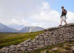 Walking on the Mourne Wall, Slieve Donard, Mourne Mountains, County Down.