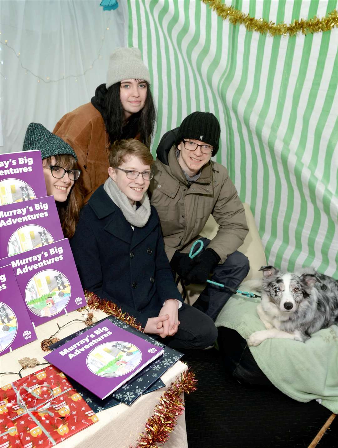 Laura Sutherland, Brogan Hunter, Liam Young and Keelan Harvey from Fortrose Academy were selling Murray's Big Adventure books at their stall with the support of Murray the dog.