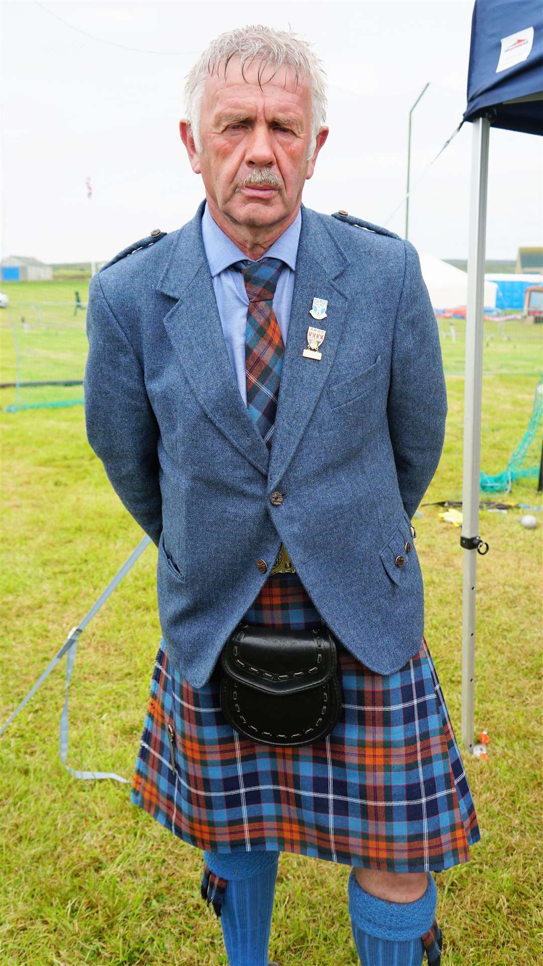 Charlie Murray, president of the Scottish Highland Games Association, worked his way around each event to adjudicate. Picture: DGS