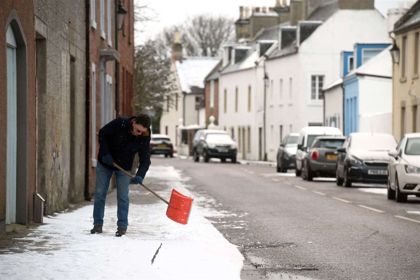 Shovelling the snow in Cromarty. Picture: James Mackenzie