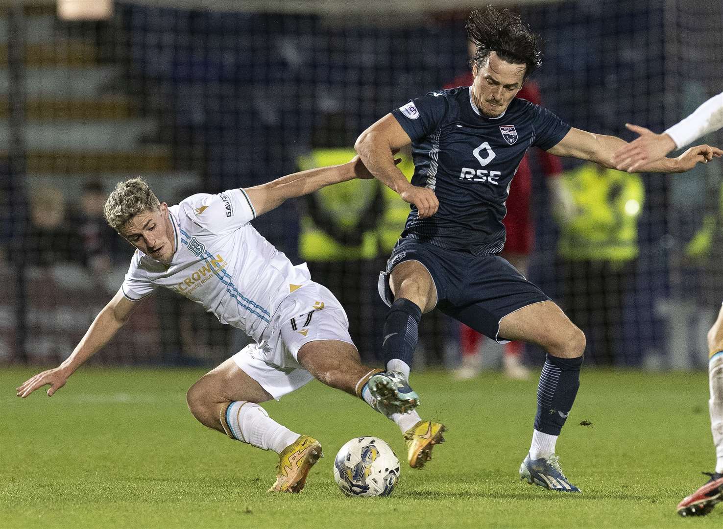 Ross County's Connor Randall gets past Dundee's Luke McCowan.