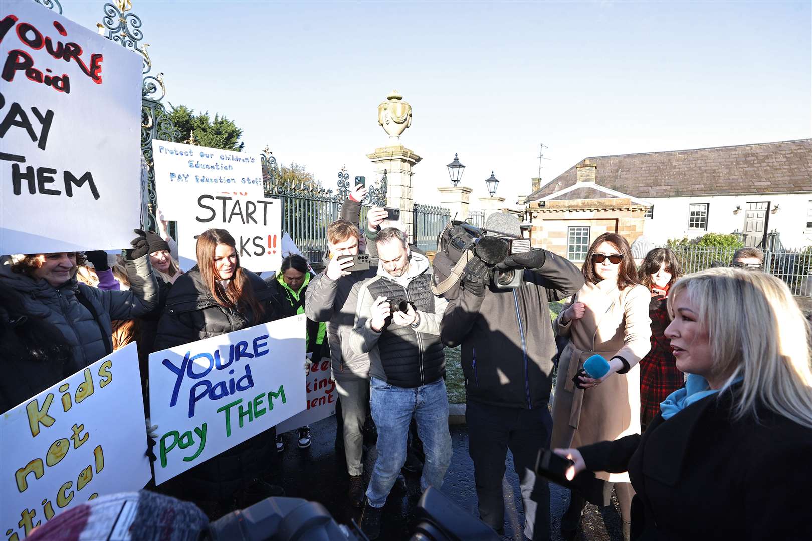 Sinn Fein vice-president Michelle O’Neill (right) speaks to protesters from the Colin Autism Support and Advice Group as they protest outside Hillsborough Castle (Liam McBurney/PA)