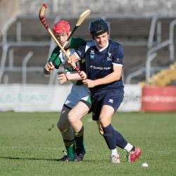 Scotland's Daniel Cameron gets away for Ireland's Steven Clynch during the second leg of the Shinty/Hurling International.