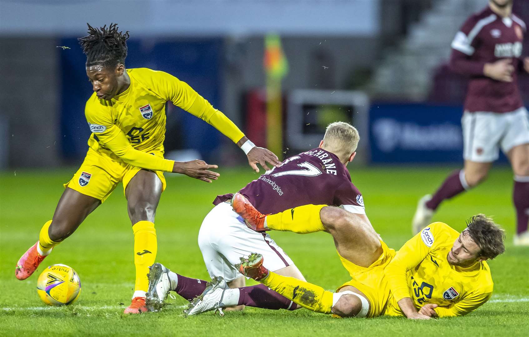 26-12-2021 Sport - football - SPFL Premiership tie. Hearts V Ross County Ross County's Joseph Hungbo gets away from Hearts' Alex Cochrane. Pic:Andy Barr www.andybarr.com Copyright Andrew Barr Photography. No reuse without permission. andybarr@mac.com +44 797492391901-05-2021