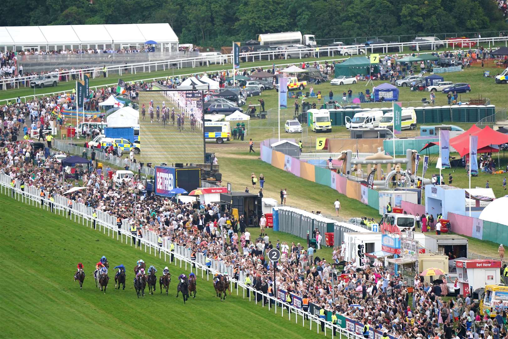 Runners and riders during the Derby (Tim Goode/PA)