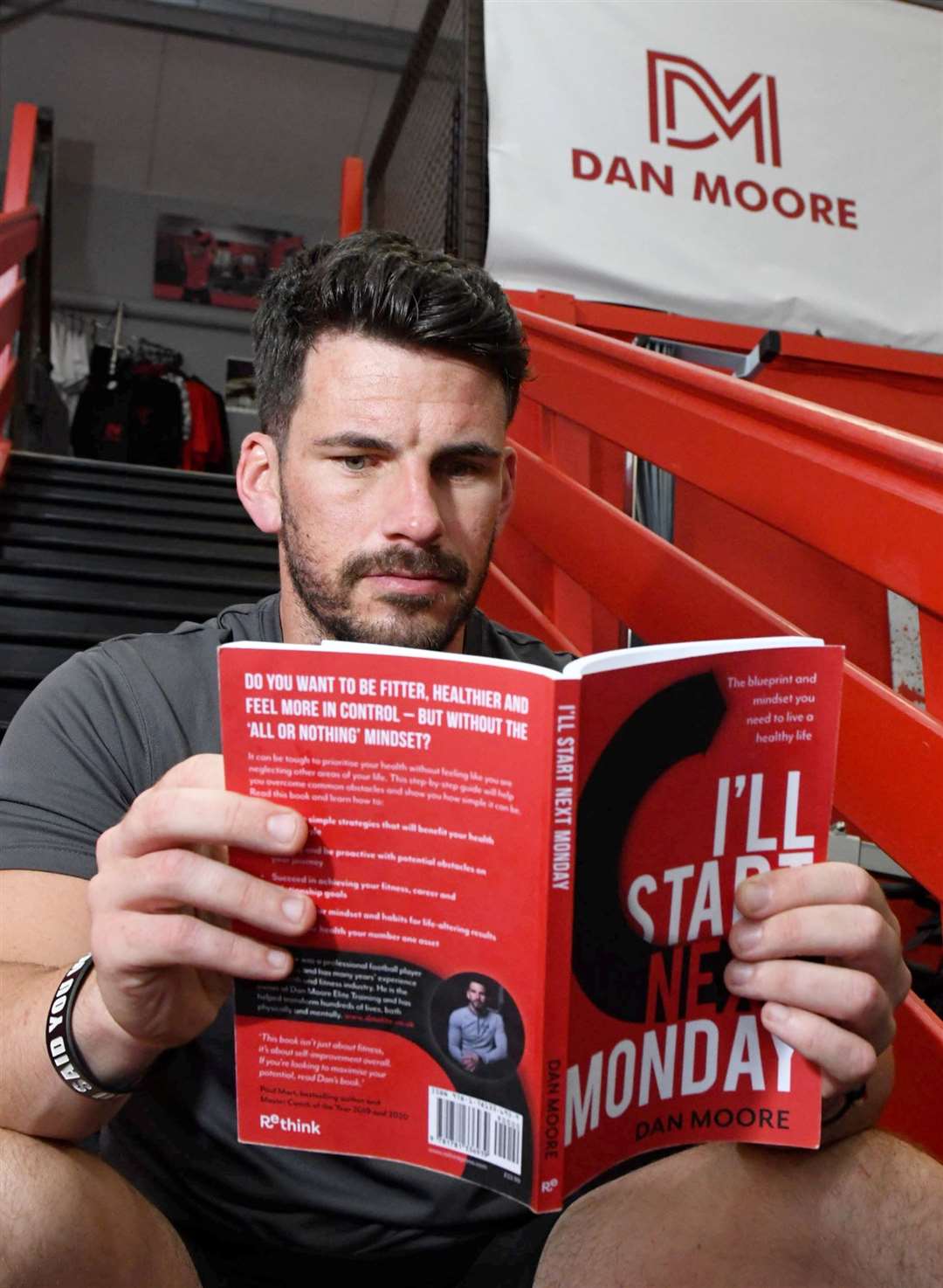 Dan Moore skimming through his new book which he has self-published. Picture: James Mackenzie