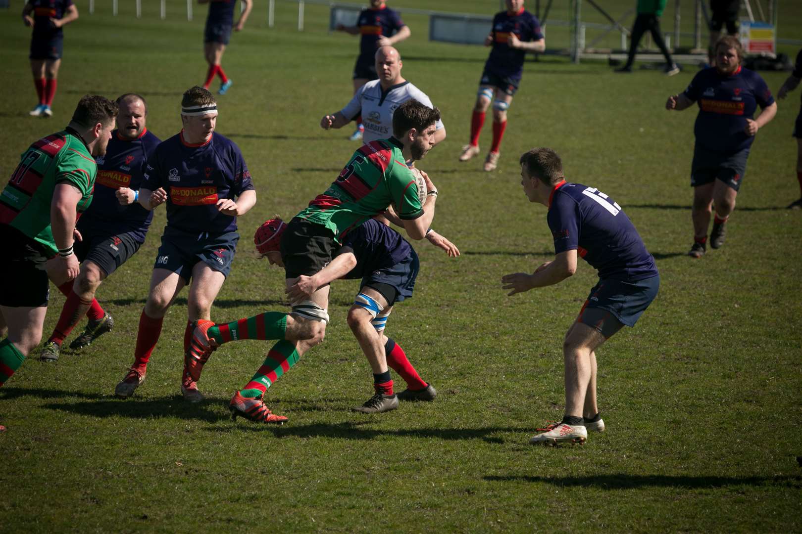 A Simpson (Highland 2nds) get tackled by his Ross Sutherland marker. Picture: Peter Carson