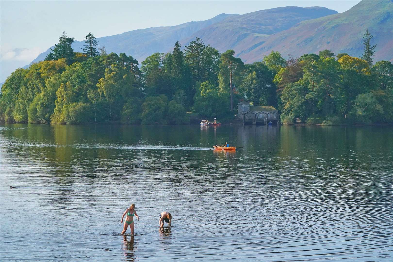 Rowers and swimmers on Derwentwater and Keswick in the Lake District on Monday (Owen Humphreys/PA)
