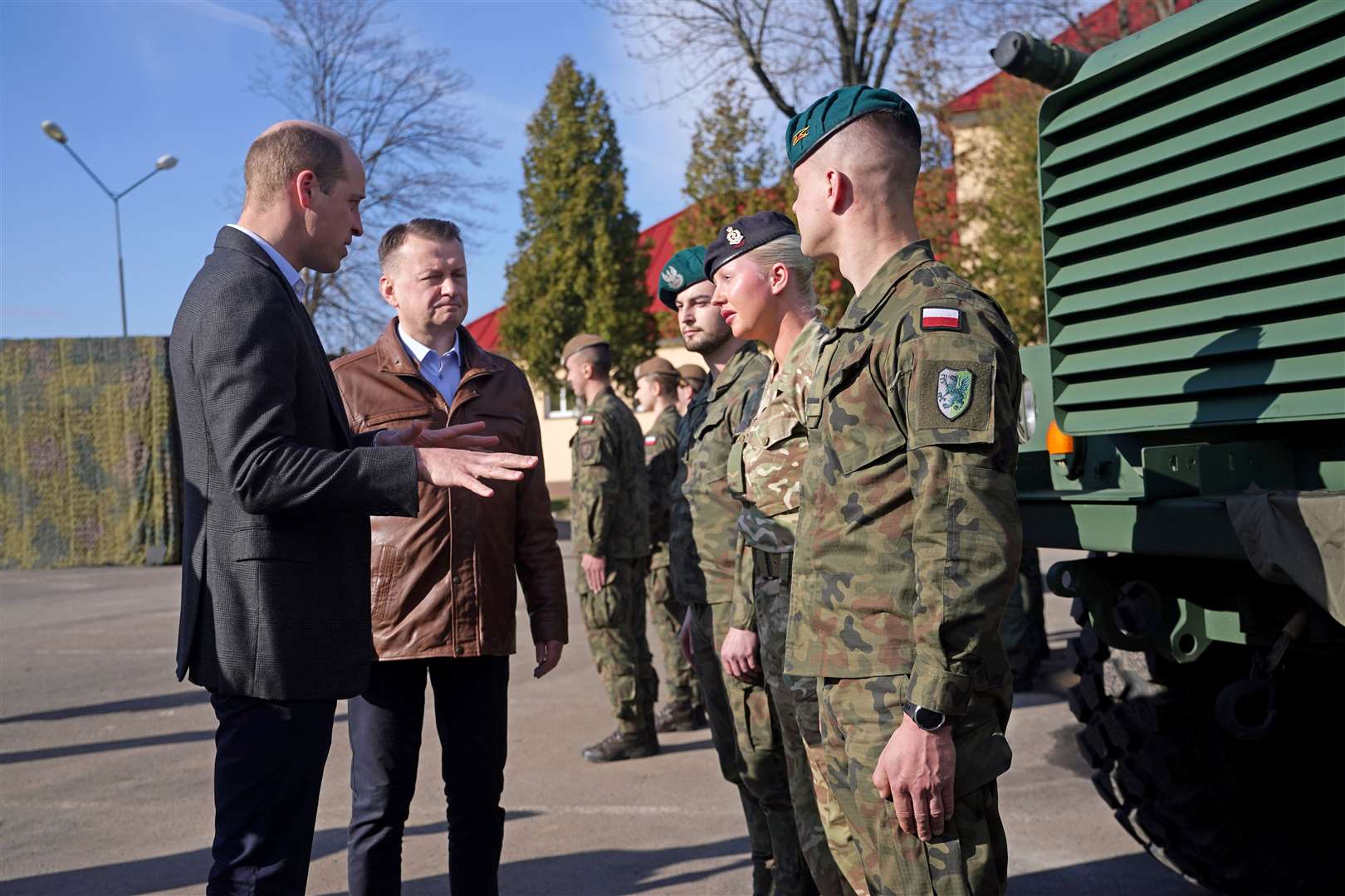 William and Polish deputy prime minister Mariusz Blaszczak (second left) meet soldiers in Rzeszow (Yui Mok/PA)
