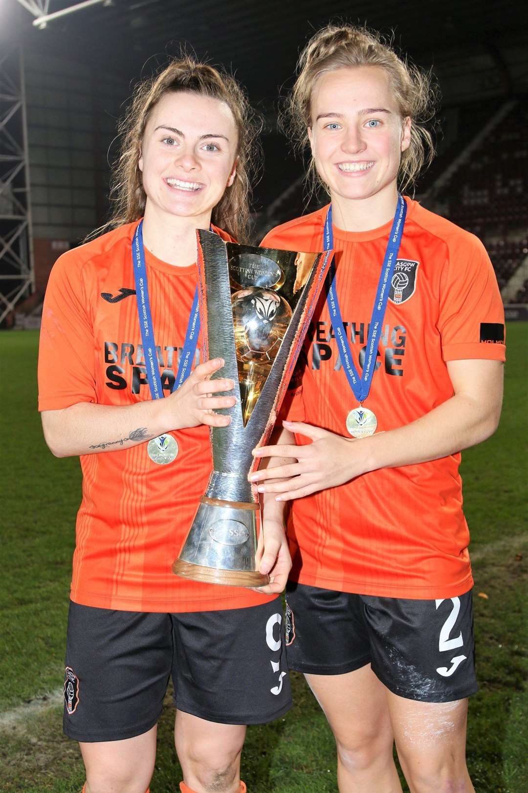 Rachel McLauchlan (right) celebrates winning the Scottish Cup after a 4-3 win over her former club, Hibernian. Picture: Tommy Hughes