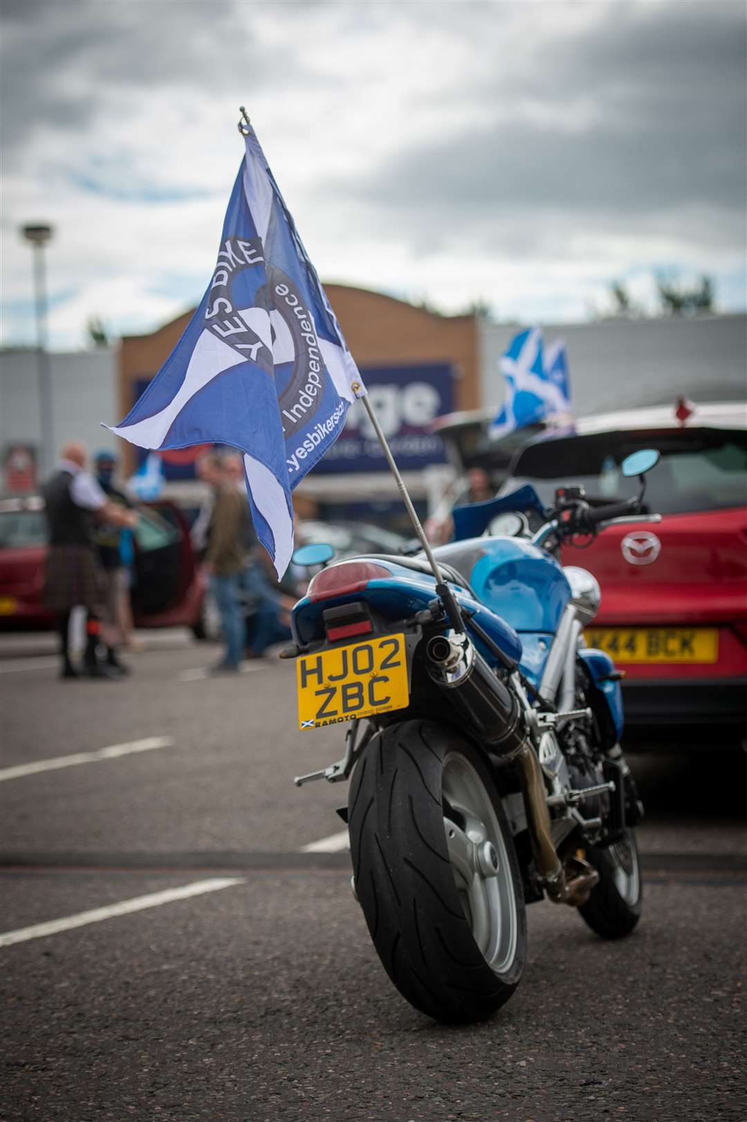 Flags fly from vehicles. Pictures: Callum Mackay