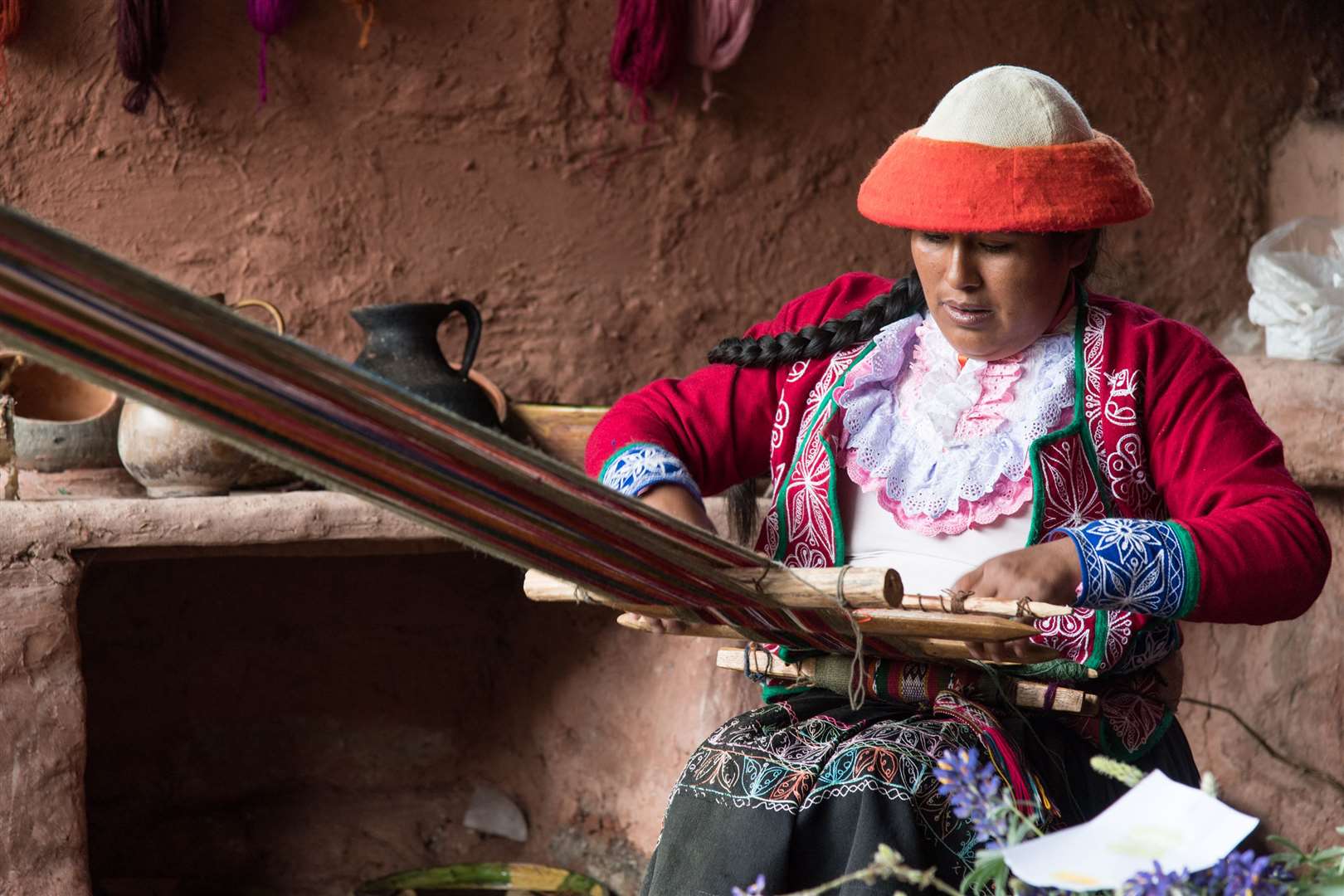 A woman weaving in a workshop at the Ccaccaccollo Weaving Co-operative, supported by Planeterra and G Adventures. Picture: PA Photo/Sarah Marshall